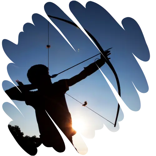 An archer drawing a bow at sunset